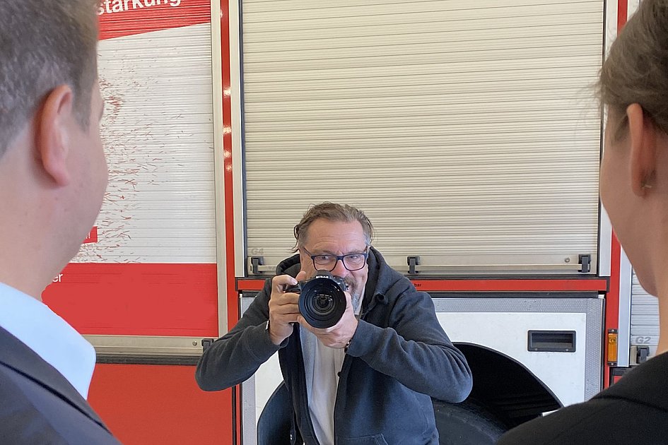 Fotograf-Feuerwehrauto-Personen
